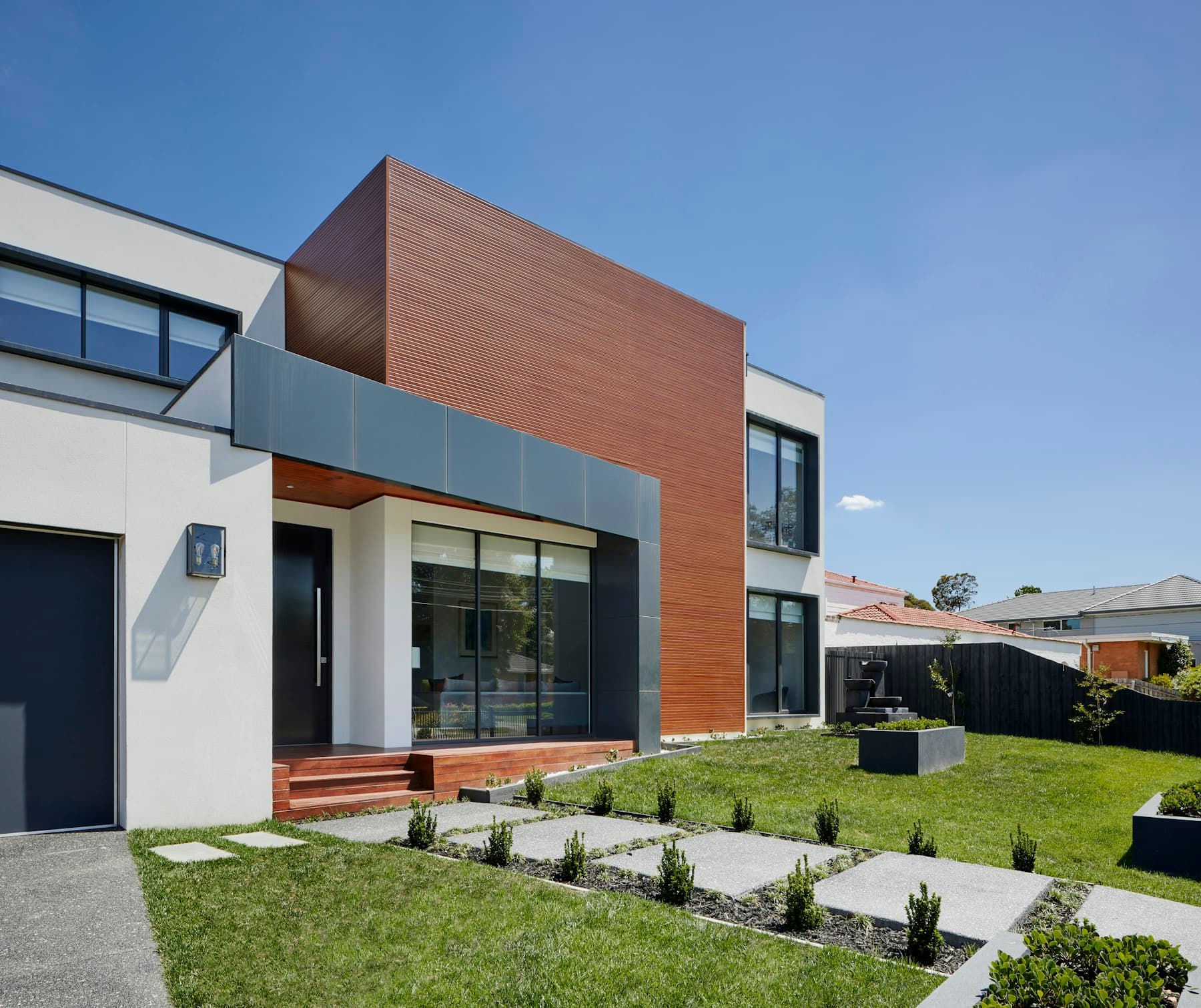 The approach, cantilevered entry, Douglas fir soffit